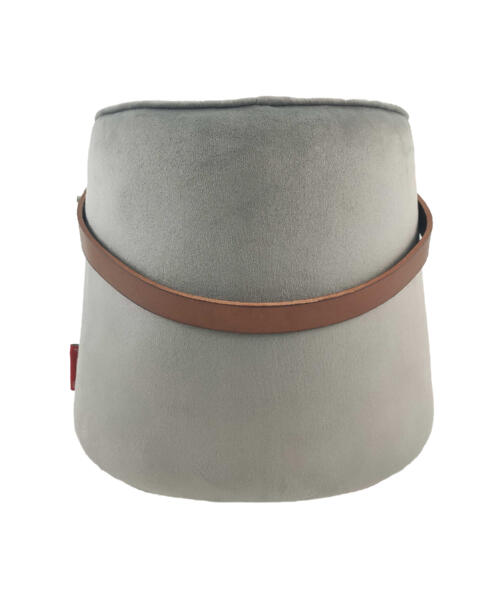 Handmade pouf styled in a quiet desert-inspired setting with minimal accessories