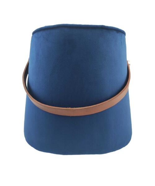 Handcrafted pouf placed on a mat in a quiet outdoor desert scene