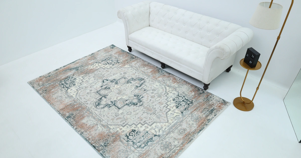 Living room showing perfect carpet placement with furniture arranged for balanced flow