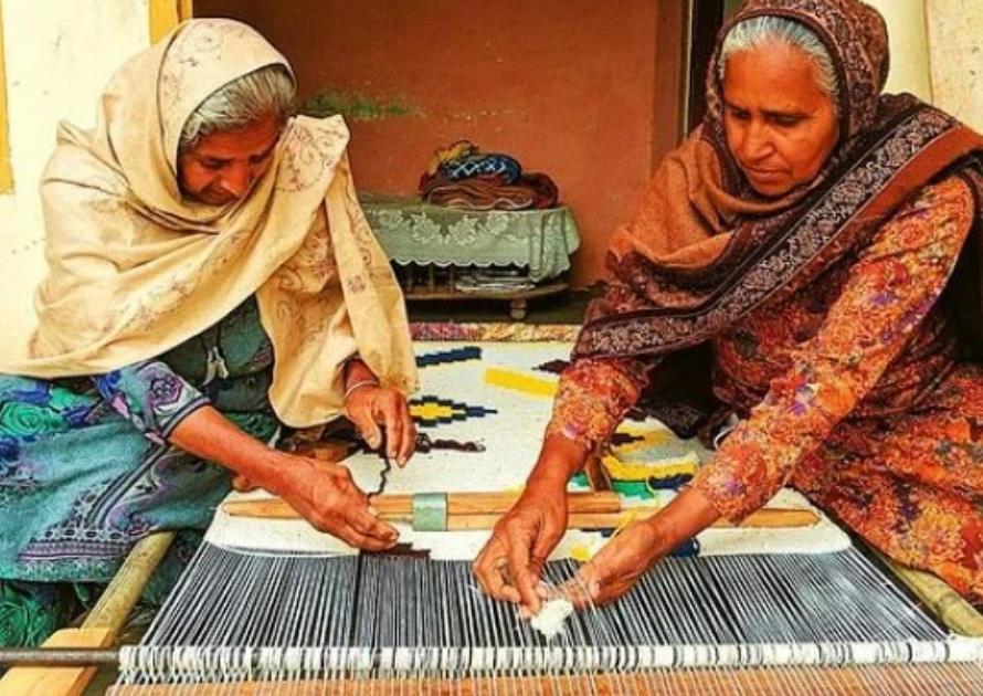 handwoven durrie rugs styled in modern living room with geometric patterns