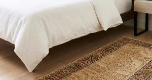 bedroom runners placed beside bed in a cozy modern bedroom